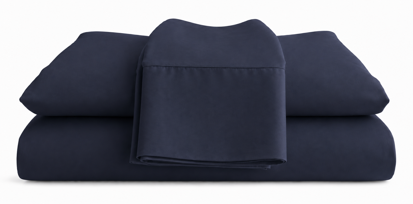 Navy blue bed sheets set on a white background