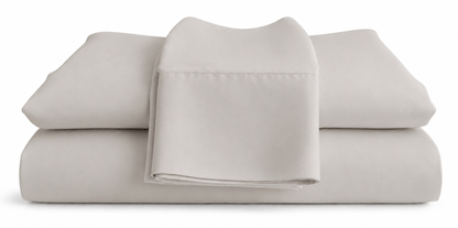 Folded stone bed sheets on a white background