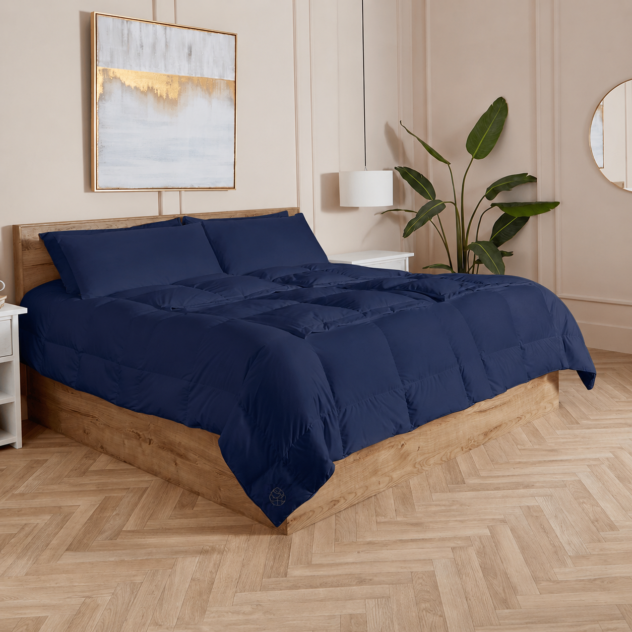 Navy Sleeping Dove cooling comforter set on a bed in a bedroom with wooden flooring and decor.