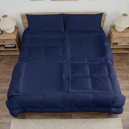 Navy Sleeping Dove cooling comforter set on a bed in a bedroom with wooden flooring and decor.