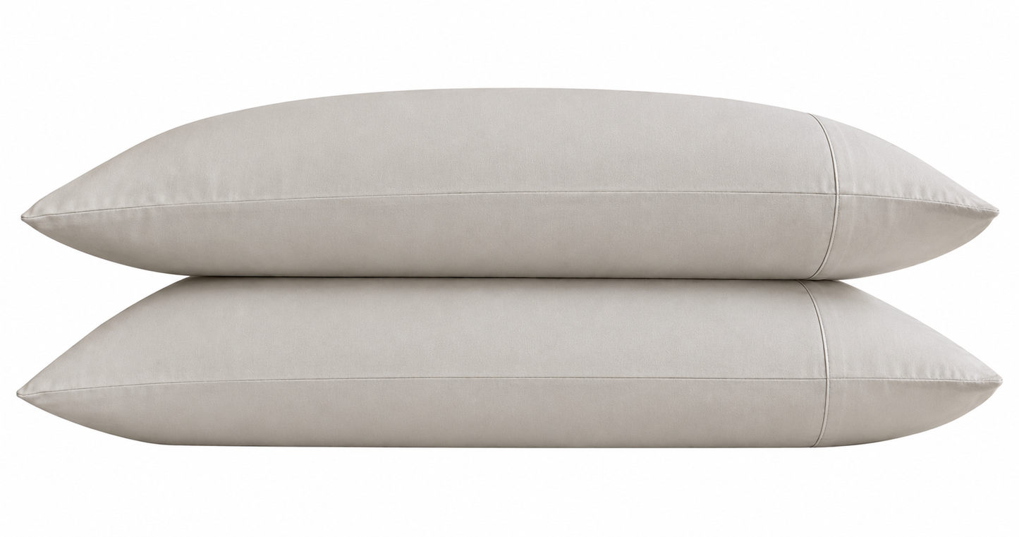 Two stone pillows stacked on a white background