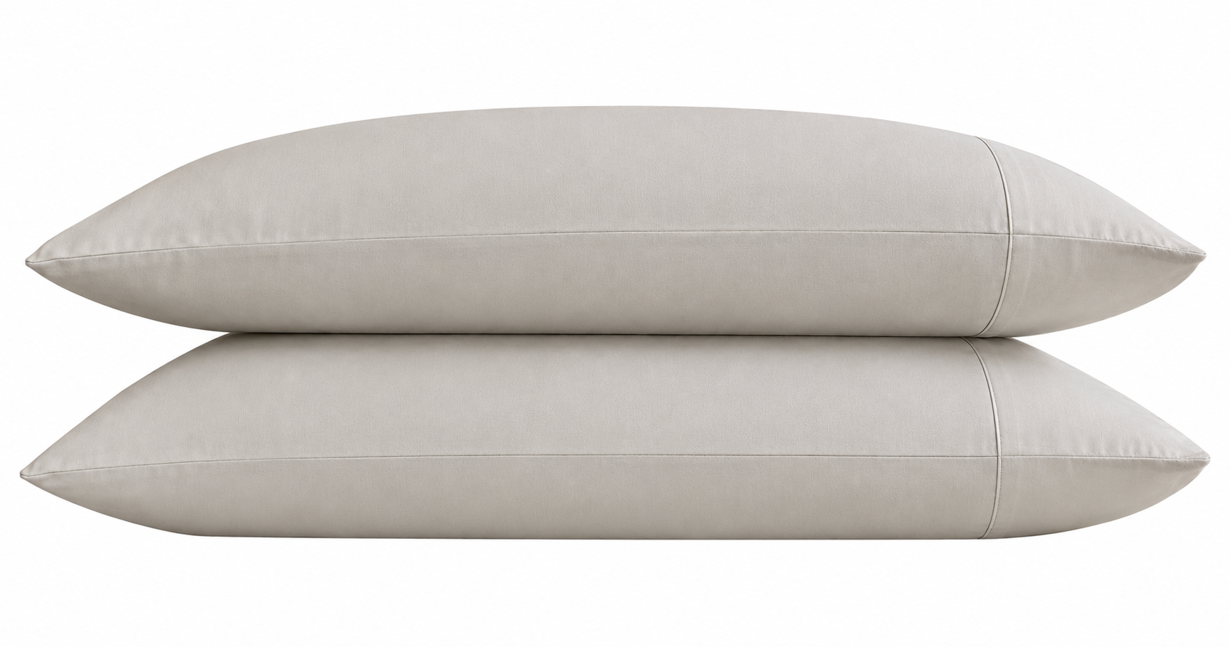 Two stone pillows stacked on a white background