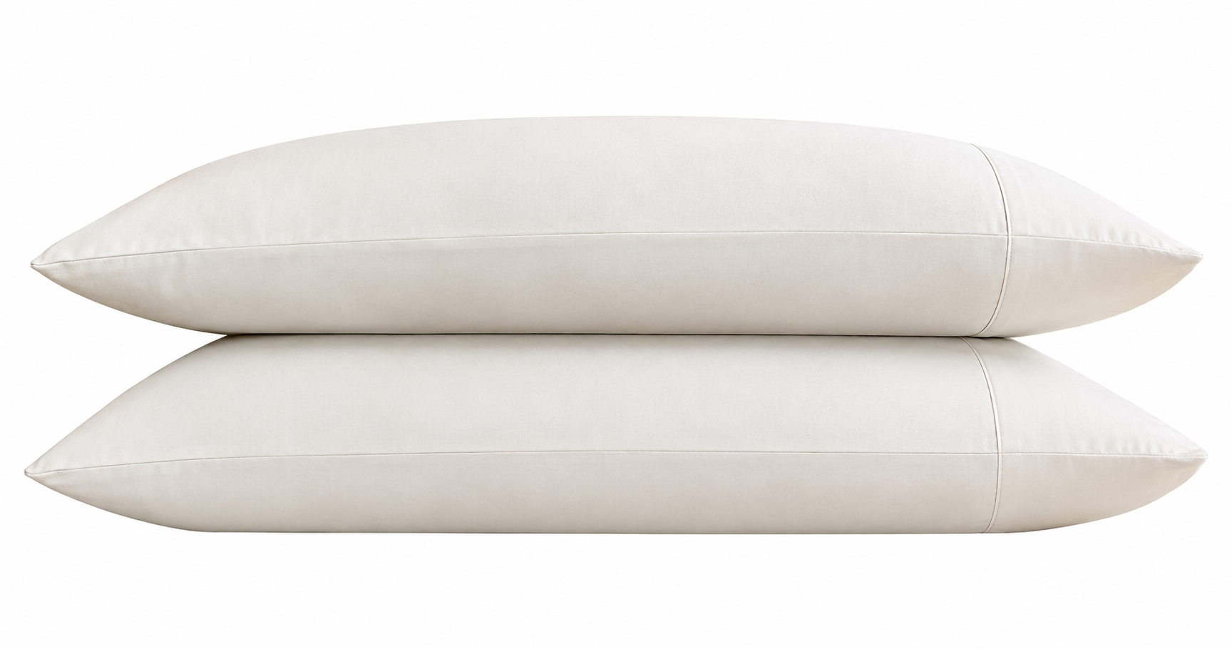 Two white pillows stacked on a white background