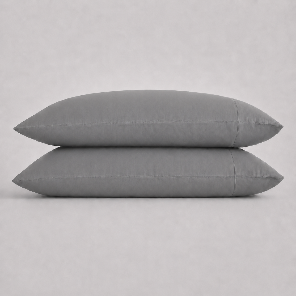 Two rectangular slate pillows stacked horizontally against a light gray background.