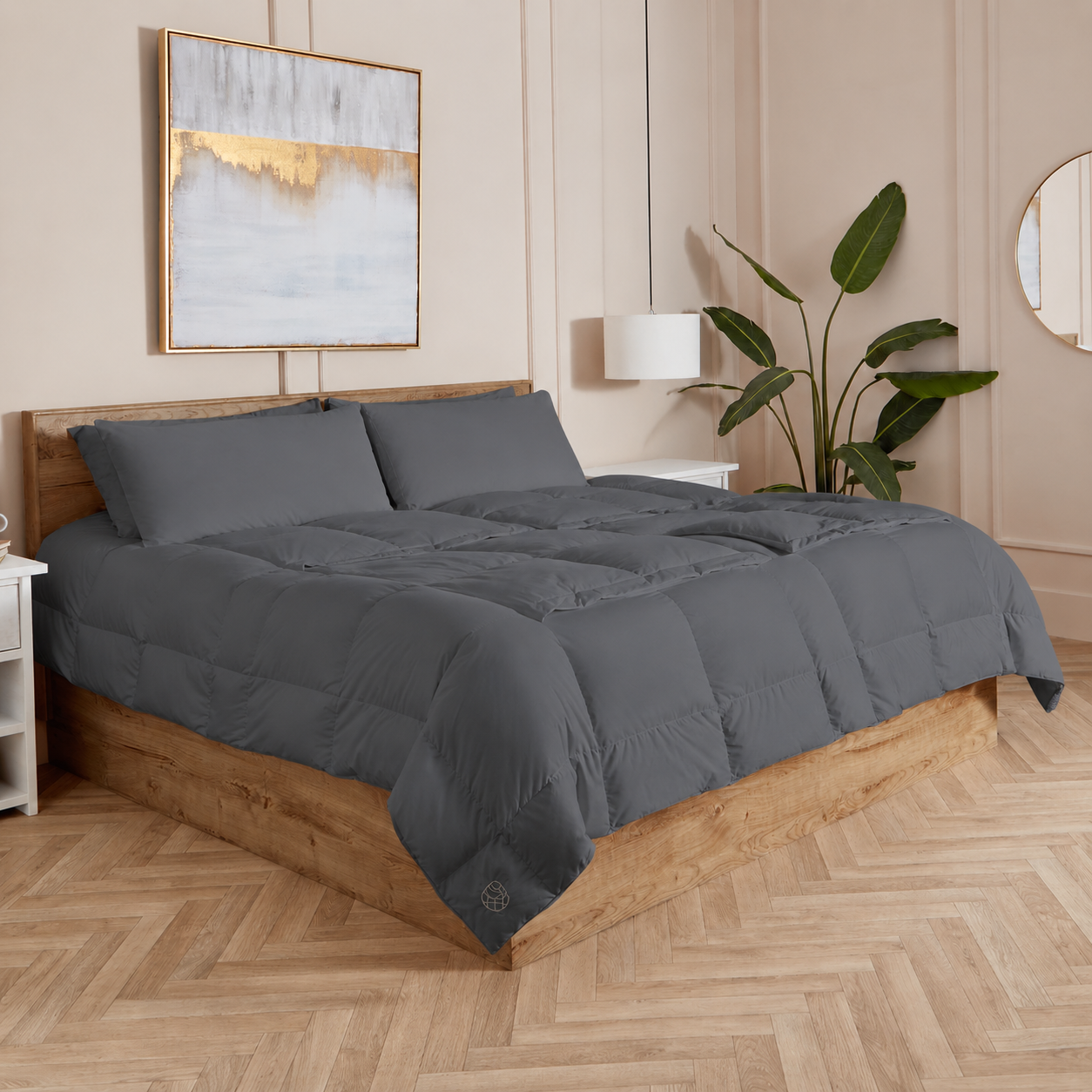Slate Sleeping Dove cooling comforter set on a bed in a bedroom with wooden flooring and decor.