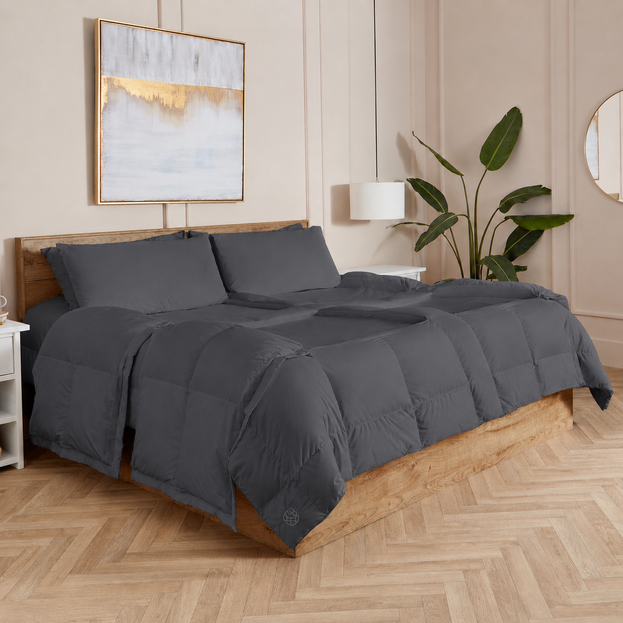 Slate Sleeping Dove cooling comforter set on a bed in a bedroom with wooden flooring and decor.