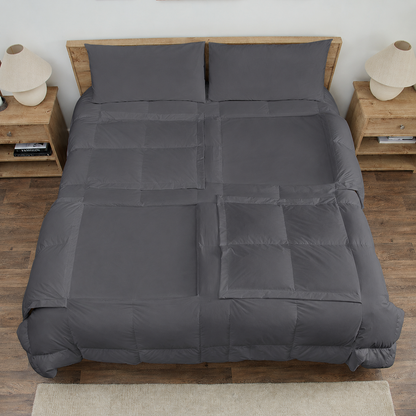 Slate Sleeping Dove cooling comforter set on a bed in a bedroom with wooden flooring and decor.