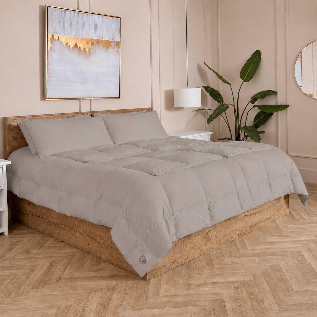 Stone Sleeping Dove cooling comforter set on a bed in a bedroom with wooden flooring and decor.