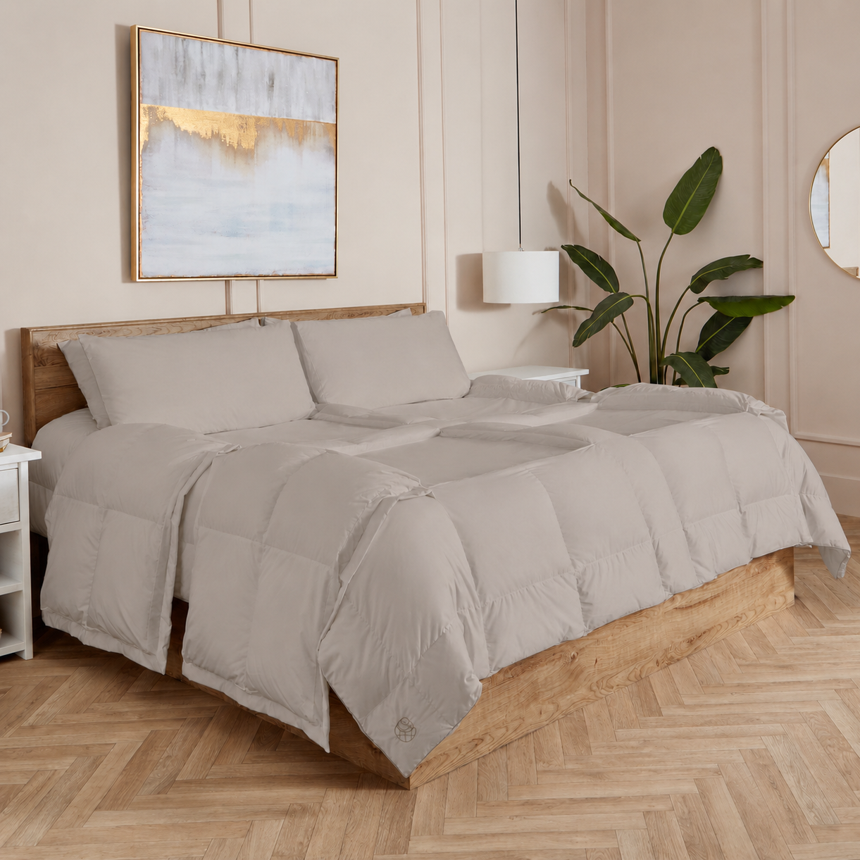 Stone Sleeping Dove cooling comforter set on a bed in a bedroom with wooden flooring and decor.