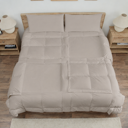 Stone Sleeping Dove cooling comforter set on a bed in a bedroom with wooden flooring and decor.