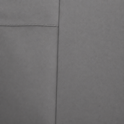 Close-up of a soft slate material surface with a visible seam and stitched detail.