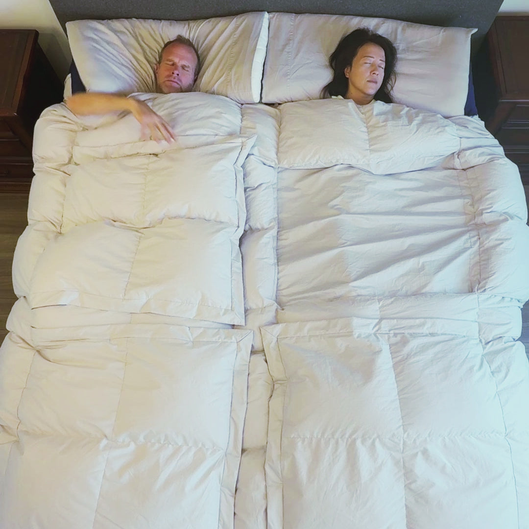 DJ and James open panels. Open or close a panel with one hand to cool down or warm up instantly—without moving the whole comforter. Shoulders stay cozy. The built-in cotton sheet keeps you covered. Targeted relief. Core or feet. Your side only. 100% cotton, baffle box construction, and premium fills.